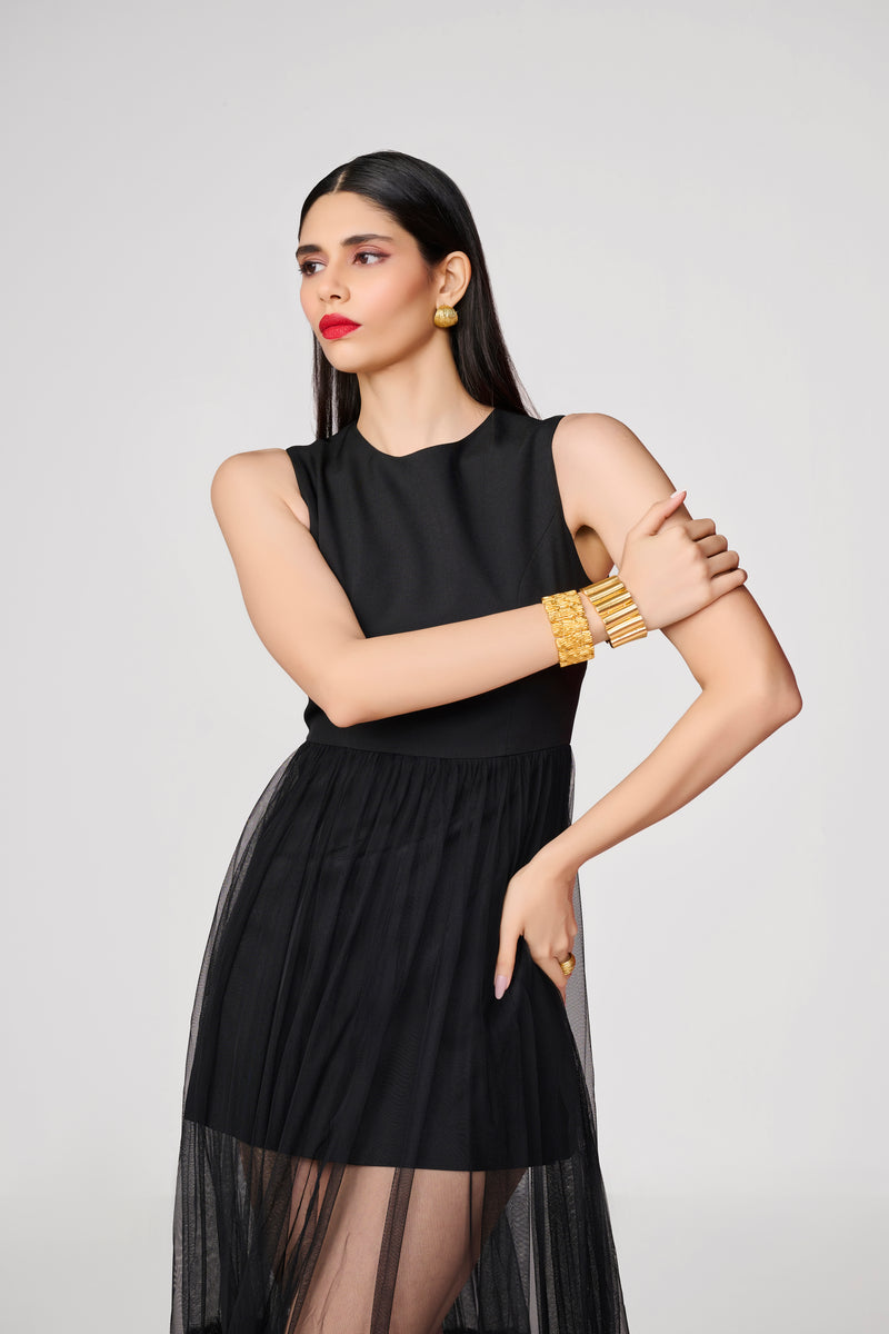 black dress with sheer bottom panel maxi for women flutter sleeves Gimaguas sophisticated look Dramatic contrast between fitted bodice and flowing sheer skirt Versatile design perfect for evening events and special occasions Make a statement after dark in this captivating sleeveless maxi dress Decadent Strapless Maxi Dress |